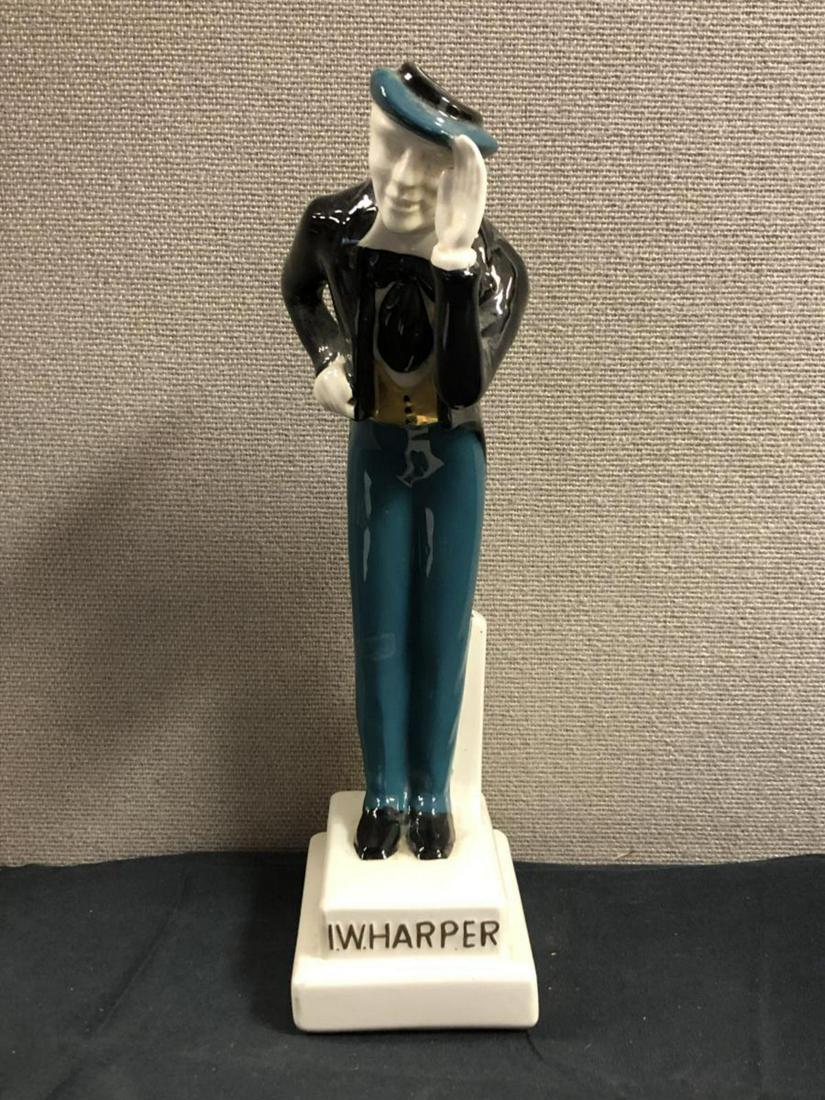 I.W. Harper Kentucky Bourbon Whiskey Decanter: Bourbon Whiskey Decanter. Original mold. Made in 1955. Figure made in Portugal 1968. I.W. Harper on base. Bottled by I.W. Harper Distilling Co Louisville Kentucky. Straight Kentucky Bourbon Whiskey 86