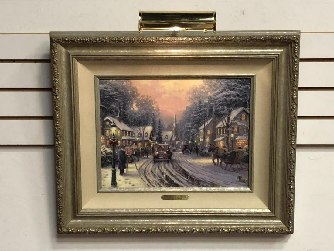 The Season of Giving Framed Thomas Kinkade Canvas: The Season of Giving Framed Thomas Kinkade Canvas. Silver Gilt ornate frame with silver fillet and linen matting, this signed and numbered limited-edition is #279/2001, and has an overall size of 25"