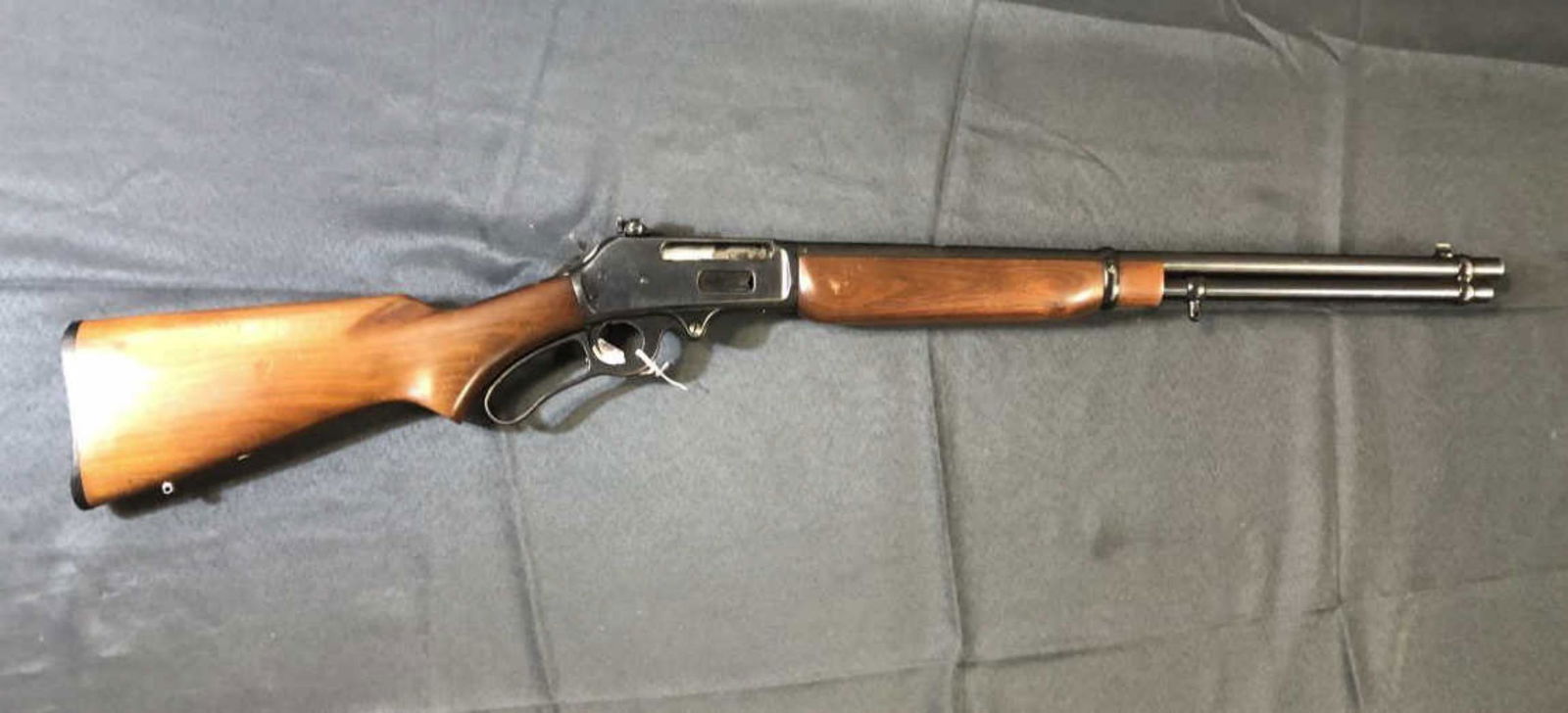 Marlin 336RC Lever Action 30-30 Rifle: Marlin Lever Action Rifle Model 336RC in 30-30 Caliber. Blue rifle in wood stocks with rear Lyman peep sight attached. 20" barrel, swivel posts, made in the USA. In good original condition, missing or