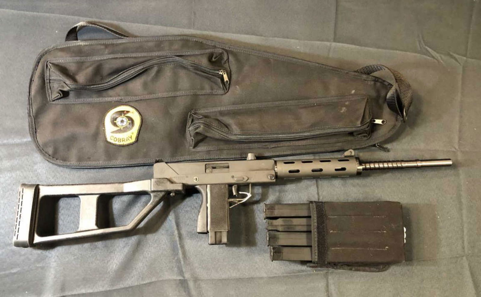 Cobray CM-11 9mm Semi-Auto Carbine Rifle w 5 Mags: Cobray CM-11 9mm Semi-Auto Carbine Rifle with 5 Magazines. Leinad. Parkerized, Heat shrouded 16 1/2" blued barrel, skeletonized plastic stock with rubber butt pad, 33" overall, rubber pistol grip, rub