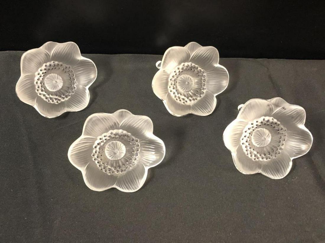 Lot Of 4 Lalique Rose Buds With Stem Paperweights: Lot Of Lalique Rose Bud With Stem. Comes four in the lot. Measures 4" across. Lalique etching on the stem base.