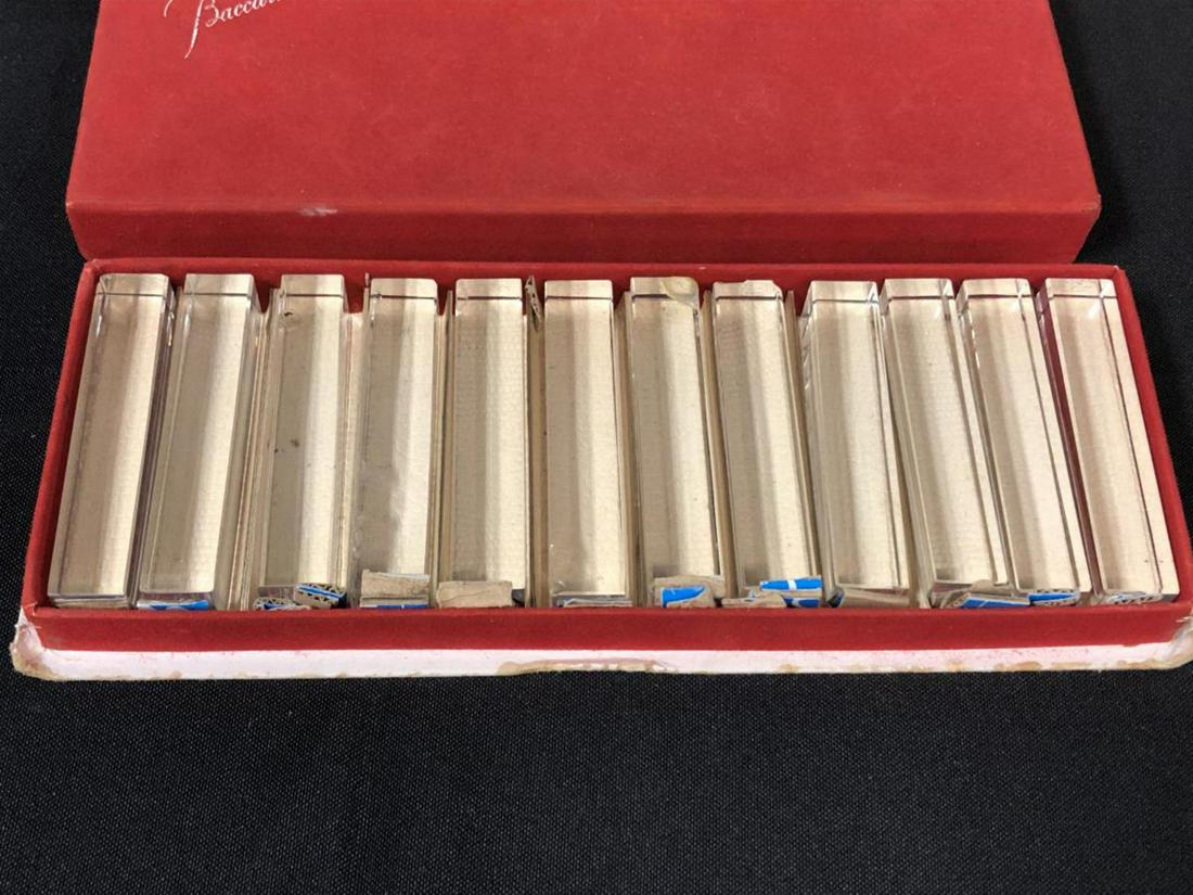 Baccarat Knife Rest Set in Original Box: Baccarat Knife Rest Set. Comes complete in original red box. 12 knife rest in the set. Some of them do have chips to them.