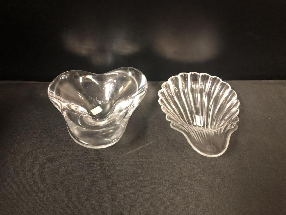 Baccarat Crystal Seashell & Candy Bowl Pair: Baccarat Crystal Seashell & Candy Bowl. Seashell stands 1 1/4" tall. Measures 6" across. Candy Bowl stands 2" tall. Measures 5 1/2" across. Baccarat etching on the bottom of each piece.