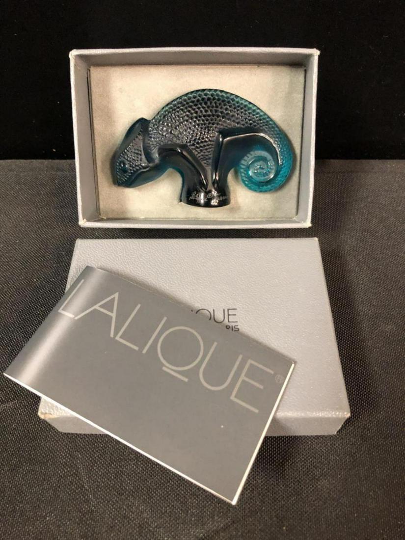 Lalique Cachet Seal Chameleon In The Box: Lalique Cachet Seal Chameleon In The Box. Comes in Lalique grey box. In 1993 Marie-Claude Lalique has enriched the bestiare by creating a little chameleon. Comes with the booklet.