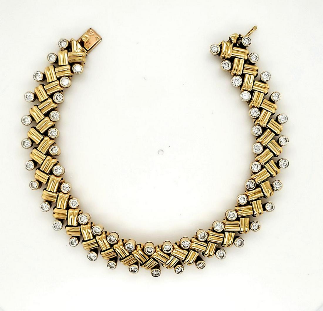 18kt Van Cleef & Arpels diamond bracelet: Ladies 18kt yellow gold diamond and textured chevron link bracelet signed “Van Cleef & Arpels, Made in France” on the back of the integrated box clasp. Design found to be part of Van Cleef & Arpel