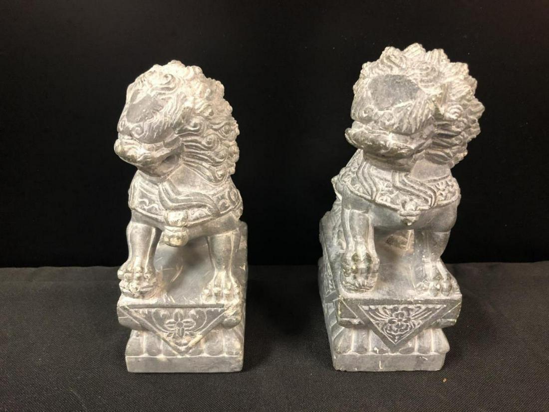Pair Of Lion Statue Bookends: Pair Of Lion Statues. Made Of Soapstone the lions sit on a base and stands 6 1/2" tall. Both lion are looking to the right.