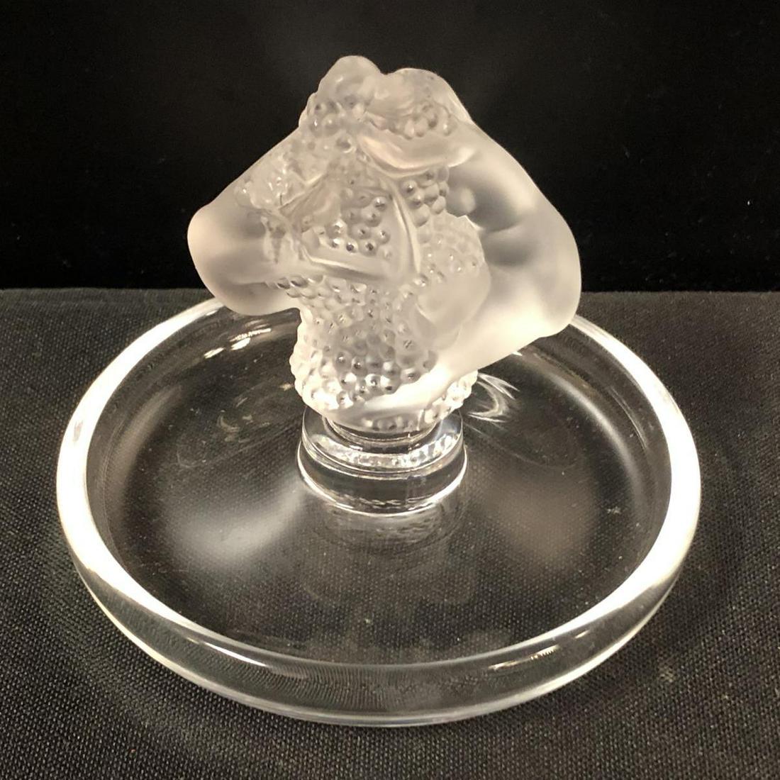 Lalique France Roxanne Ring Holder: Lalique France Roxanne Ring Holder. Holder Cendrier dish nude women grapes. Stands 3" tall. Lalique etching on the bottom.