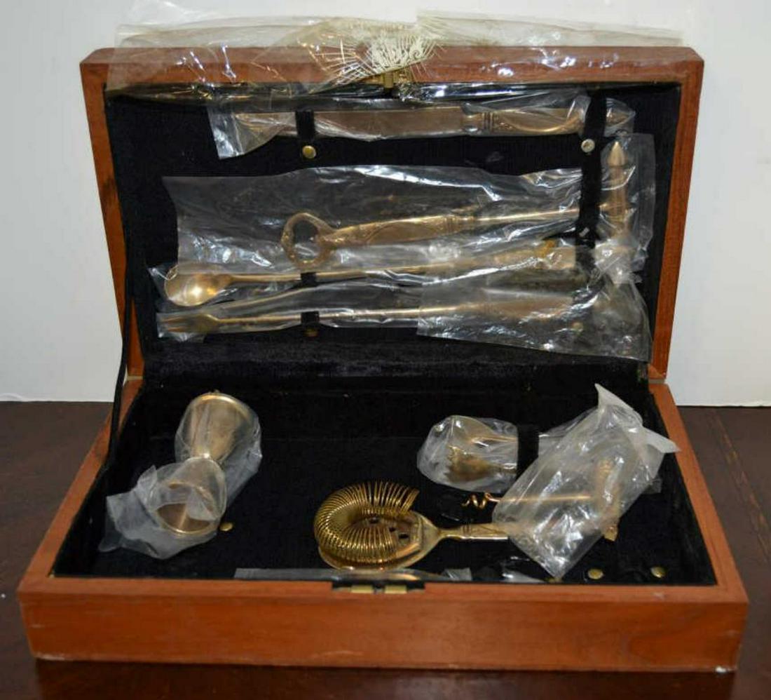 9 Piece Thai Bronzeware Bar Set in Wood Case: 9 piece bar set of Thai bronzeware from the 1960's in original hinged wood presentation box with black felt liner. Many pieces are still in the original plastic packaging.