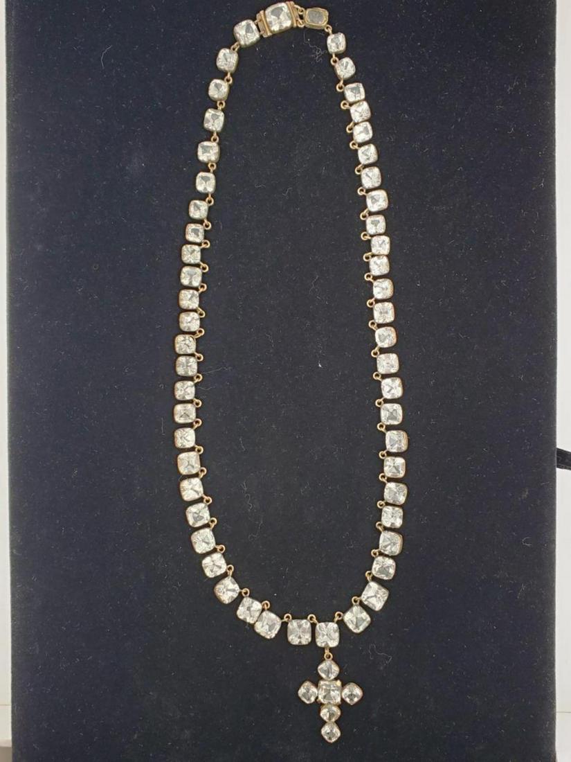 Vintage 14kt yellow gold goshenite beryl necklace: Ladies vintage 14kt yellow gold necklace containing bezel set graduated princess cut colorless goshenite beryl and contains a removable cross pendant of the same bezel set princess cut colorless goshe