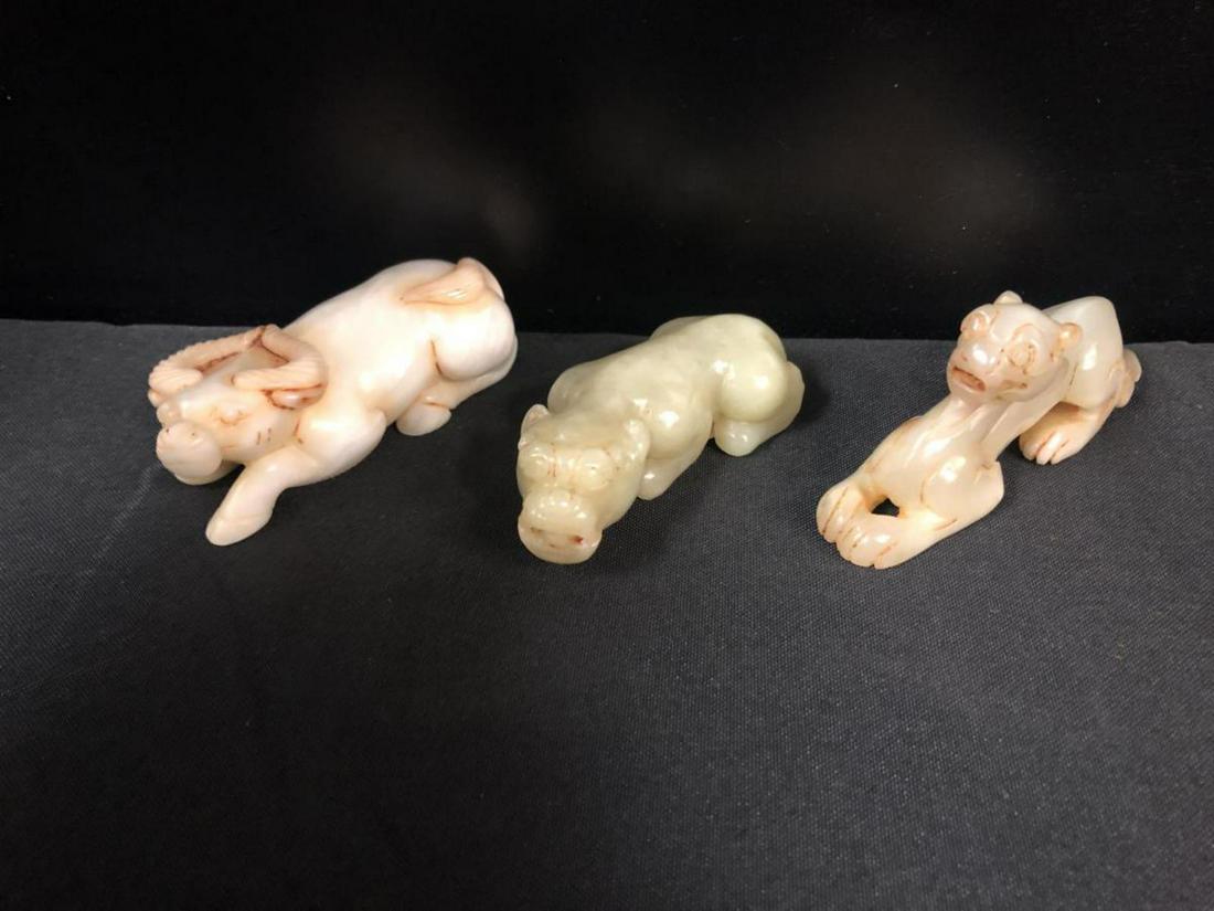 Soapstone Stone Chinese Carved Mythical Animals: Soapstone Stone Chinese Carved Mythical Animals. Three carved figurines in the lot. Consists of an ox and two mythical creatures. Also included in this lot is a Chinese Foo Dog soapstone figurine seal