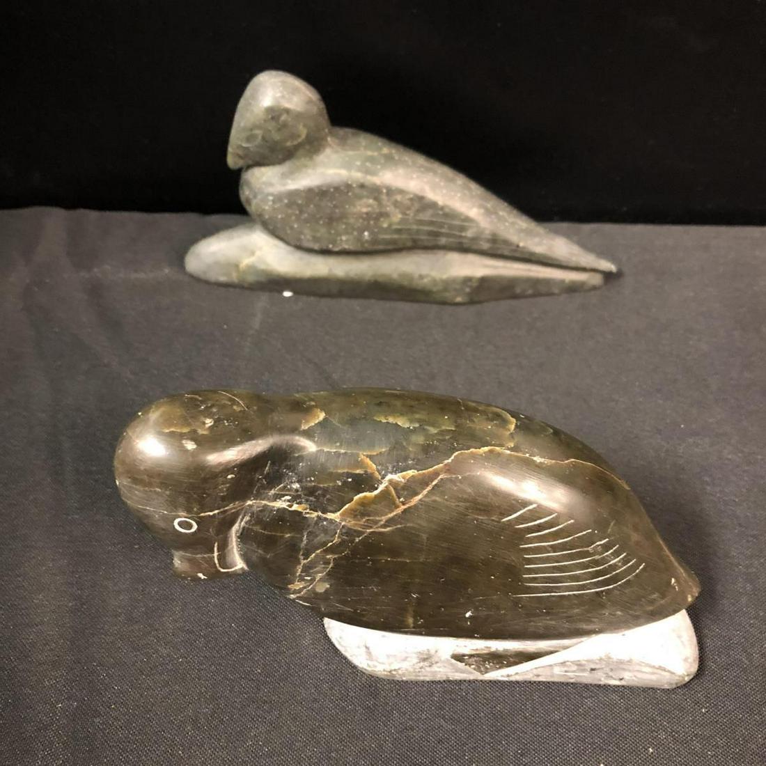 Soapstone Stone Duck Loon Statues: Soapstone Stone Duck Statues. First duck stands 4" tall and measures 6" across. Second duck stands 4" tall and measures 7" across. Both have numbers on the bottom of the statues.