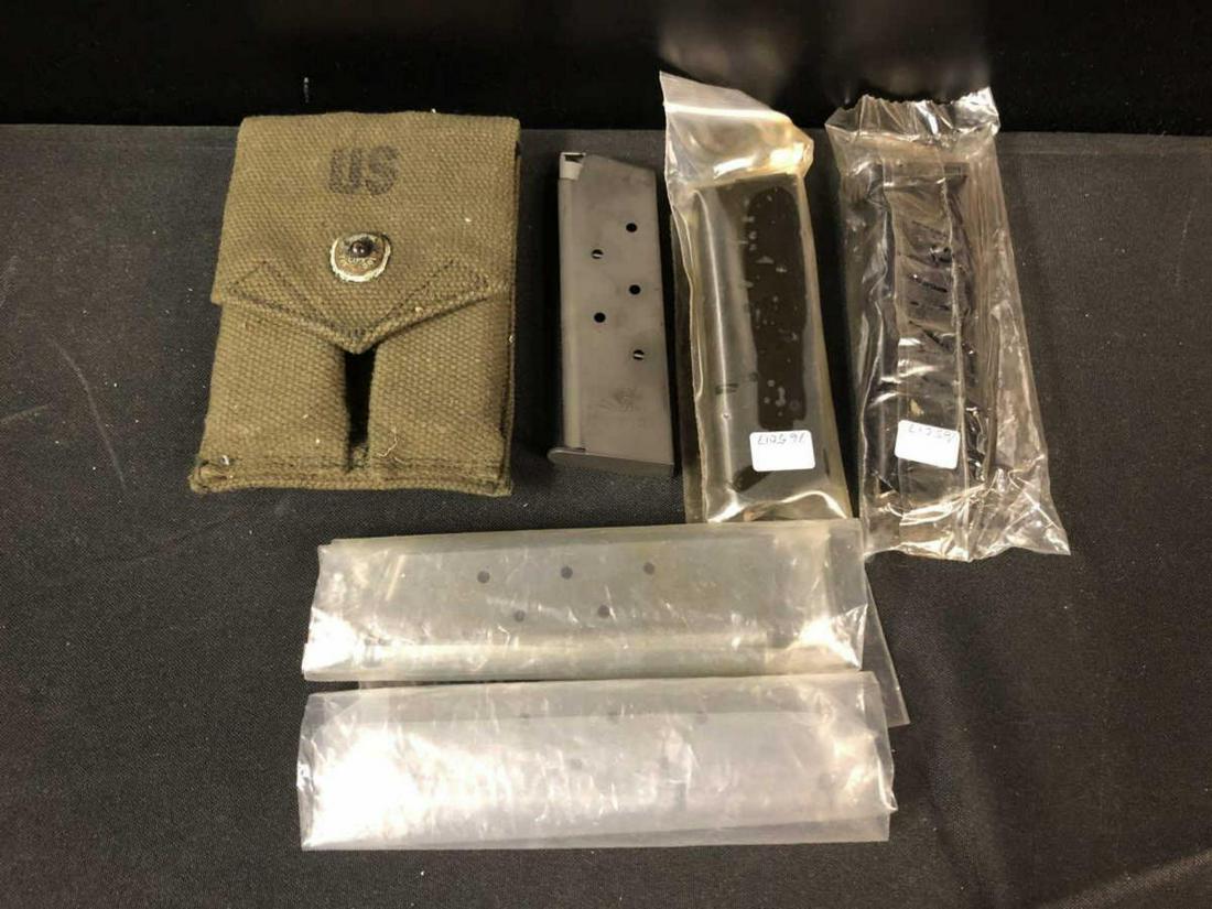 Group of 7 Like New .45 Colt Pistol Magazines: Group of 7 Like New Metal .45 Colt Pistol Magazines in Blue & Stainless with a Double Military Belt Pouch. Two SS mags or clips are marked Marlin, cross-over fit to the Camp 45 Rifle. Flush fit 7 roun
