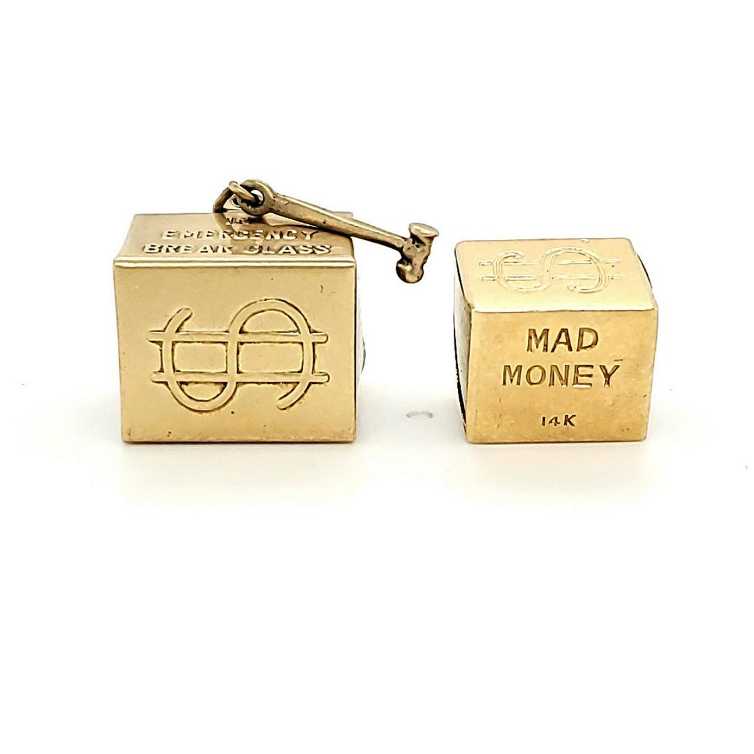 14kt yellow gold Mad Money charms: 14kt yellow gold "Mad Money" charms featuring a 14kt yellow gold box filled with a folded $1 bill and capped with plastic on each side. Gross weight 7.9 grams.