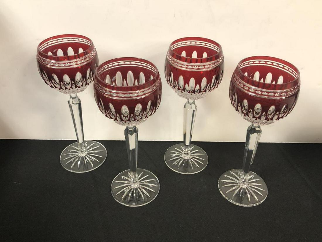 4 Red Cut to Clear Waterford Wine Crystal Glasses: Lot of 4 Red Cut to Clear Waterford Wine Crystal Glasses. Each one stands 7 7/8" tall. Each one is etched Waterford on the bottom. No chips, cracks, nicks or flaws noted.