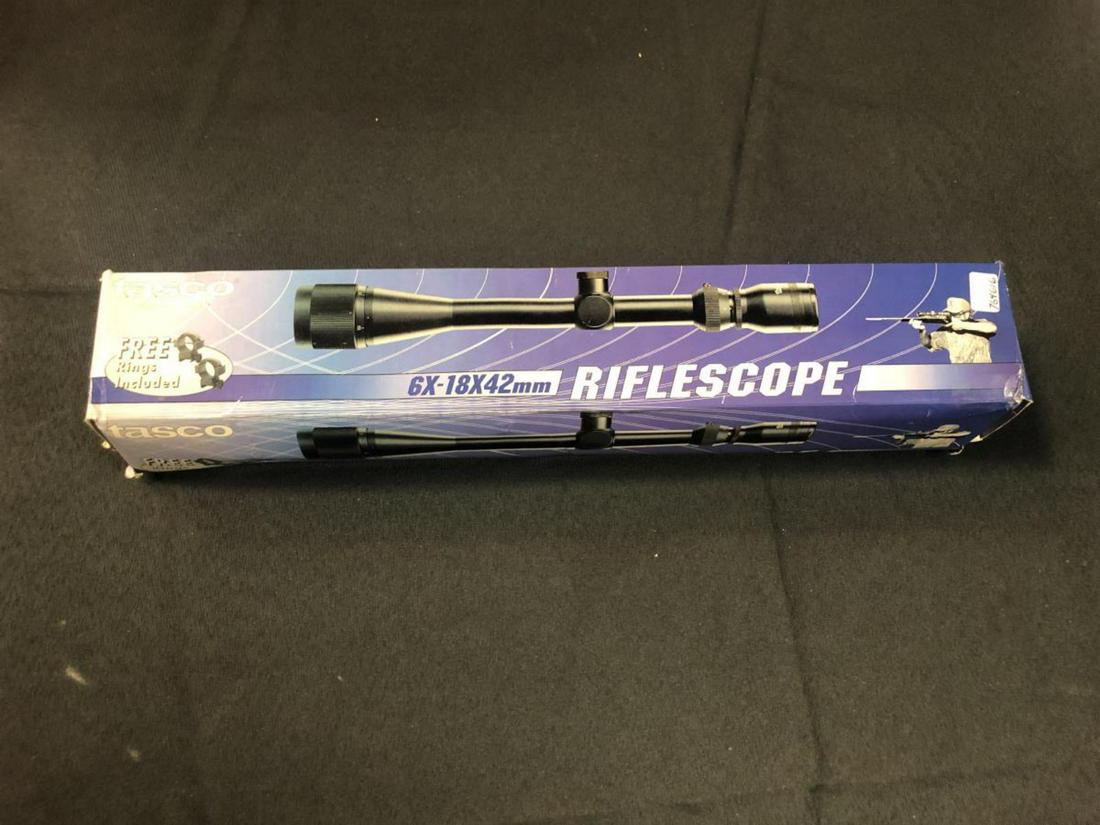 Tasco 6X-18x42mm Scope in Box Never Used w Rings: Tasco 6X-18x42mm Scope in Box Never Used w Rings with Booklet of Instructions. Tinted lens covers included {cords are weak}. Model SPL618X42R. Black tone. Cross hair reticle, 15 1/2".