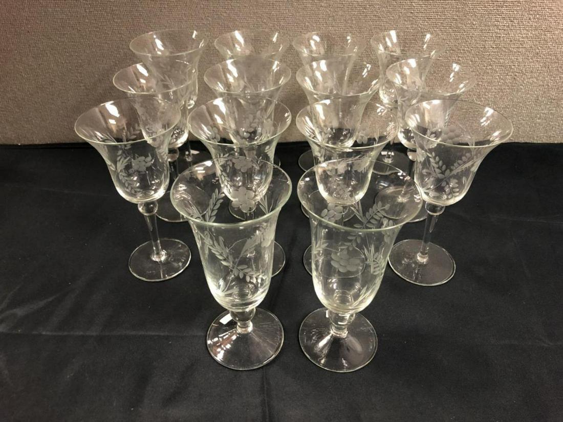 Lot Of Floral Etched Glassware: Lot Of Floral Etched Glassware. Total of 14 in the lot. Consists of 12 long stemmed wine glasses standing 7 3/4" tall. 2 water glasses standing 7 1/2" tall.