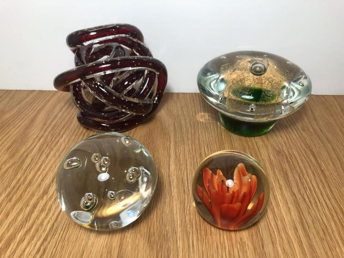 Lot of 4 Glass Orb Paperweights: Lot of 4 Glass Orb Paperweights. The larger one is a mushroom style, green with gold flake interior, and is 4.5” diameter and 3” tall. The other 2 orbs are a 3” with bubbles inside, and a 2” w