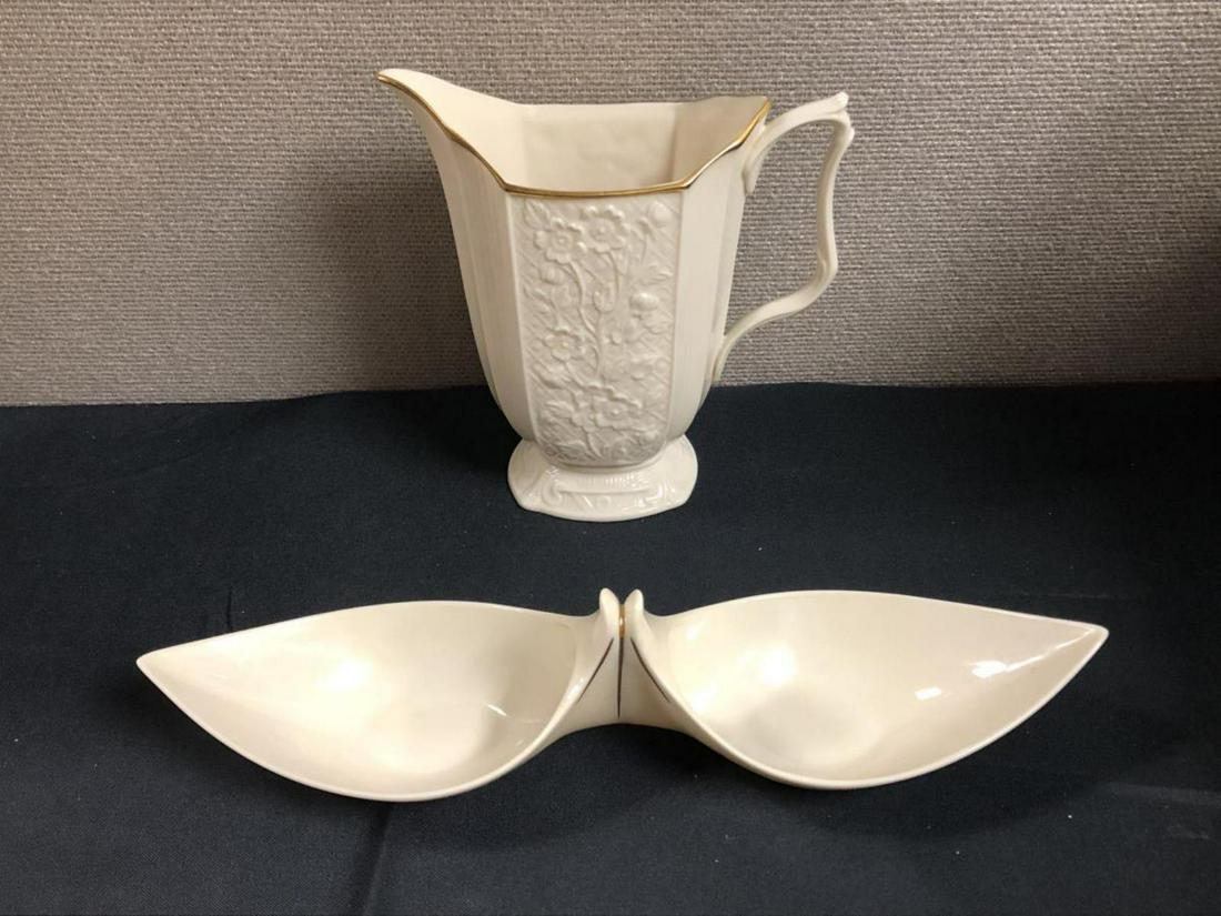 Lenox Handled Vase & Nut/Candy Dish: Lenox Footed 20 oz. Pitcher with Gold Trim from the Carolina Collection. Status: Discontinued. Actual: 1978 - 1981. Stands 6 1/2" tall and 7 1/2" wide. Flower patterns on outside of vase. Lenox Nut/Ca
