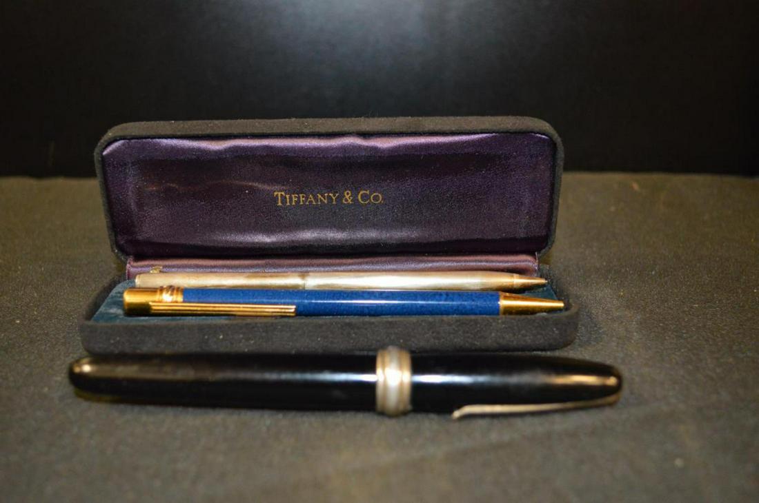 3 Vintage Pens & Pencil by Cartier & Tiffany & Co: An Interesting Lot of Three Vintage Collectible Writing Instruments by Cartier & Tiffany & Co. This listing will include 1-Cartier blue roller ball cartridge pen with blue barrel & gold tone tip & cli