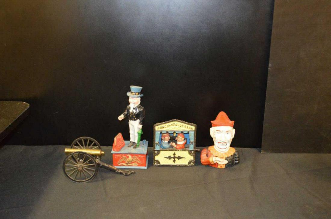 Lot Of Vintage Reproduction Cast Iron Banks: Lot Of Vintage Reproduction Cast Iron Banks. Total of 3 in the lot. Consists of Uncle Sam. Punch And Judy Bank which does not work. Humpty Dumpty Clown. Aslo included Replica Of Gettysburg Cast Iron T