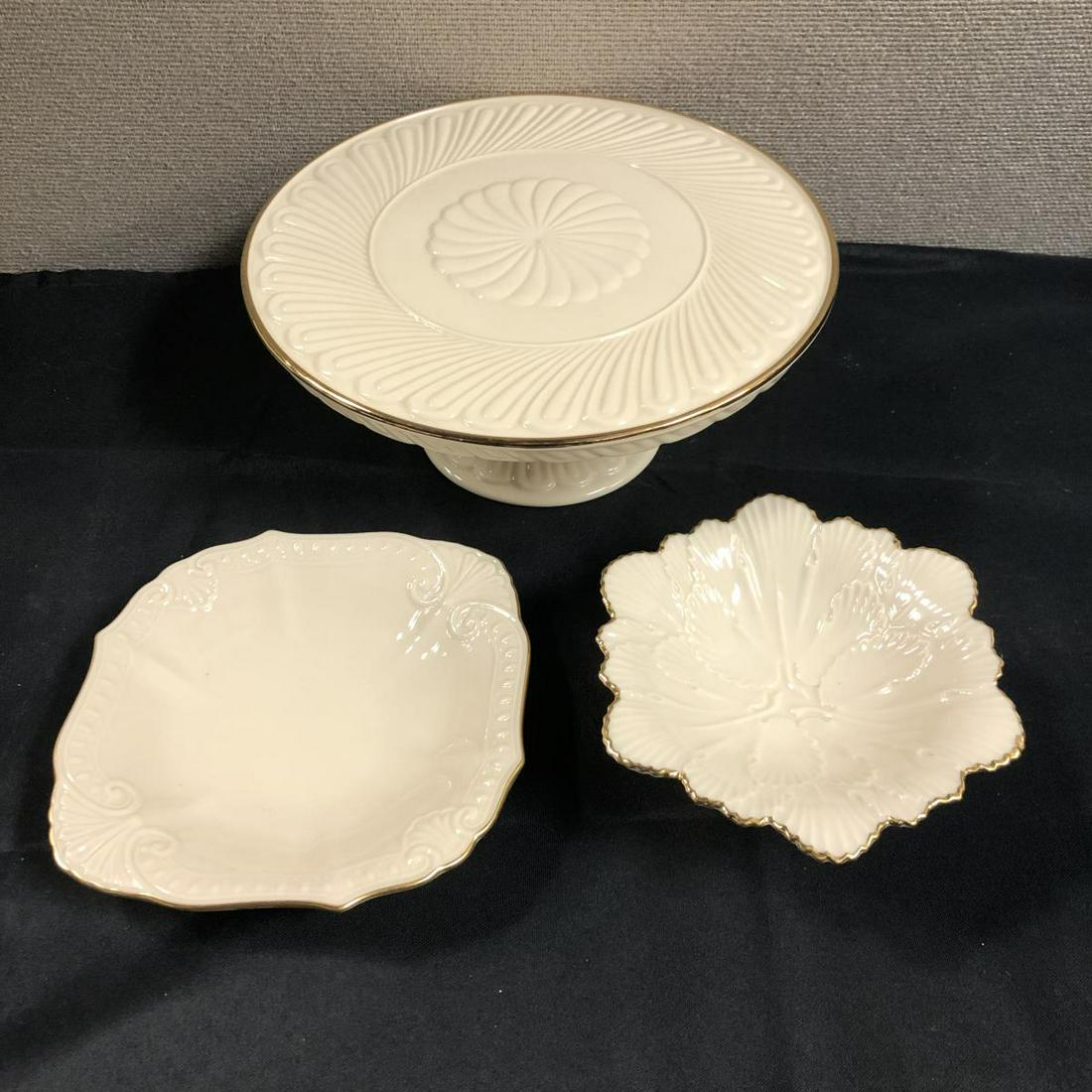 3 Pcs Lenox Porcelain China: 3 Pcs Lenox Porcelain China. Lenox House Warming Cake Plate. SKU#6249627. Stands 4 1/2" tall. Measures 11" across. Lenox Candy Dish. Hand decorated with 24 karat gold. Measures 2 1/2"x6".Lenox small p