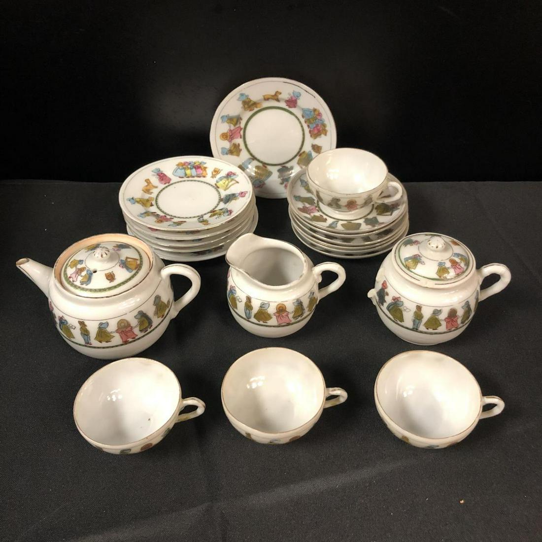 Quaint Doll Porcelain Vintage Tea Set: This doll tea set features the figures of children around the edge. Set consists of 6 plates, 6 saucers and 4 cups, 1 teapot, 1 creamer, and 1 sugar bowl, but one handle is broken off.
