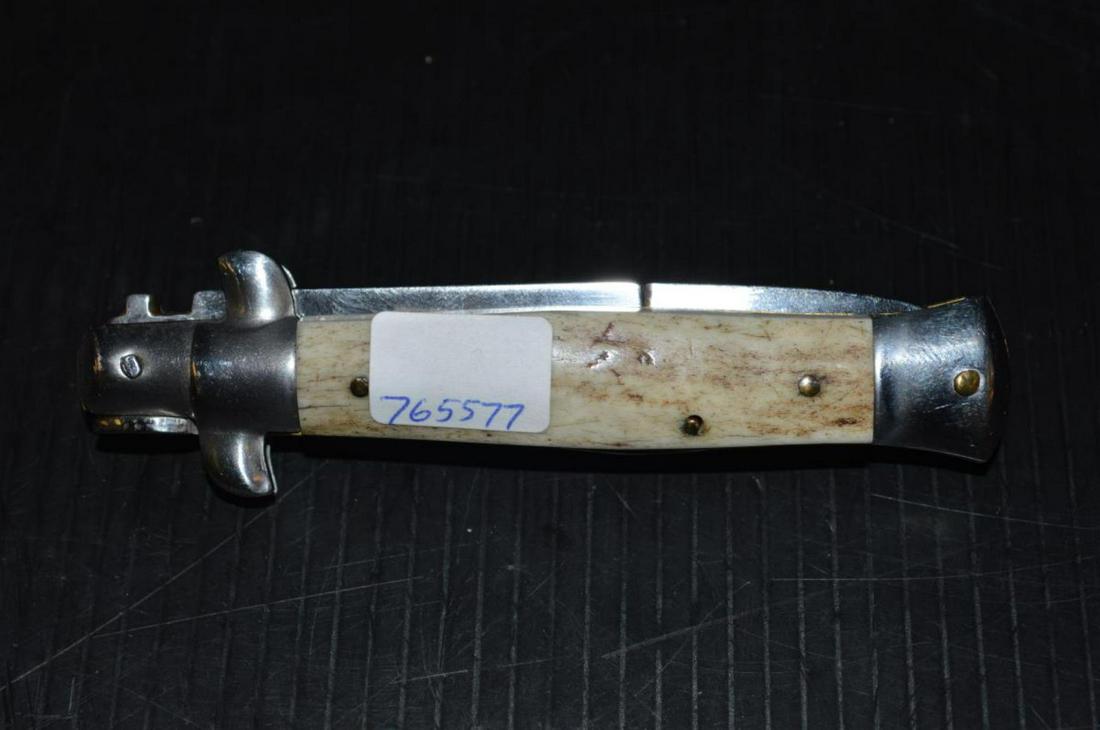 Automatic Knife Marked Stiletto Italy Stag Handles: Automatic Fishtail Knife Marked Stiletto Italy on Blade with Stag Handles. It has a polished 3" blade. It is 3 7/8" closed, 7" over all & 69.6 grams. Sharpened on one edge. Know your states laws as we