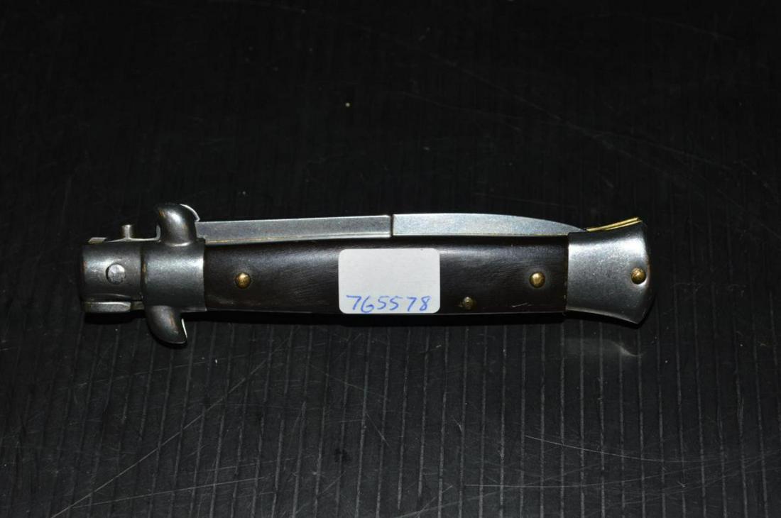 Frank Beltrame Stiletto Switchblade Knife Buffalo: Vintage Frank Beltrame stiletto switchblade automatic knife with buffalo horn handles. The knife features a bayonet style blade marked "Frank B. Italy" sharpened on one edge. Fishtail end. 3 1/4" blad