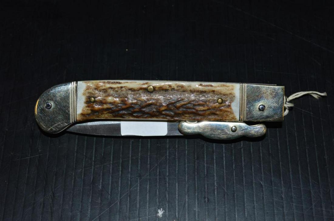 Hubertus Automatic Open Stag Knife The Guardian: Hubertus Vintage Automatic Flick Knife with Stag Handles, Brass Frame engraved blade. This great knife features a 2 3/4" blade. It is 7" overall & 4 1/4" folded & is 109 grams. Wonderful condition. Th