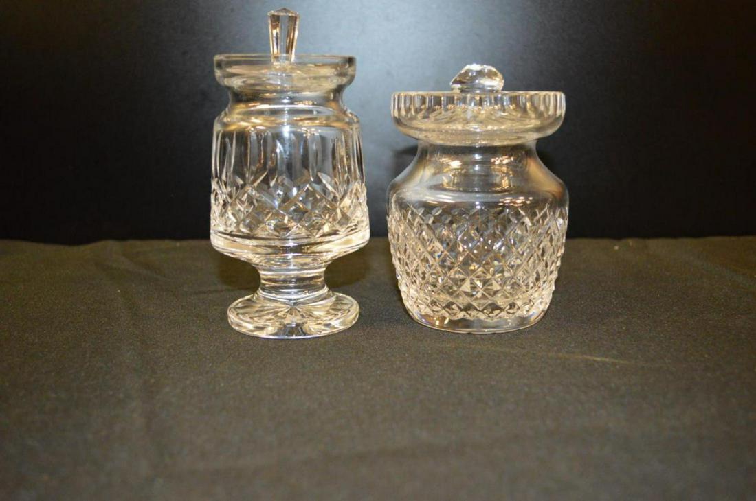 Pair Of Waterford Cut Crystal Candy Dishes: Pair Of Waterford Cut Crystal Candy Dishes. Waterford Candy Dish w/lid. Stands 6" tall. Lid has a small chip on the side. Waterford Candy Dish w/lid. Stands 4 1/2" tall. Has Waterford etching on the b