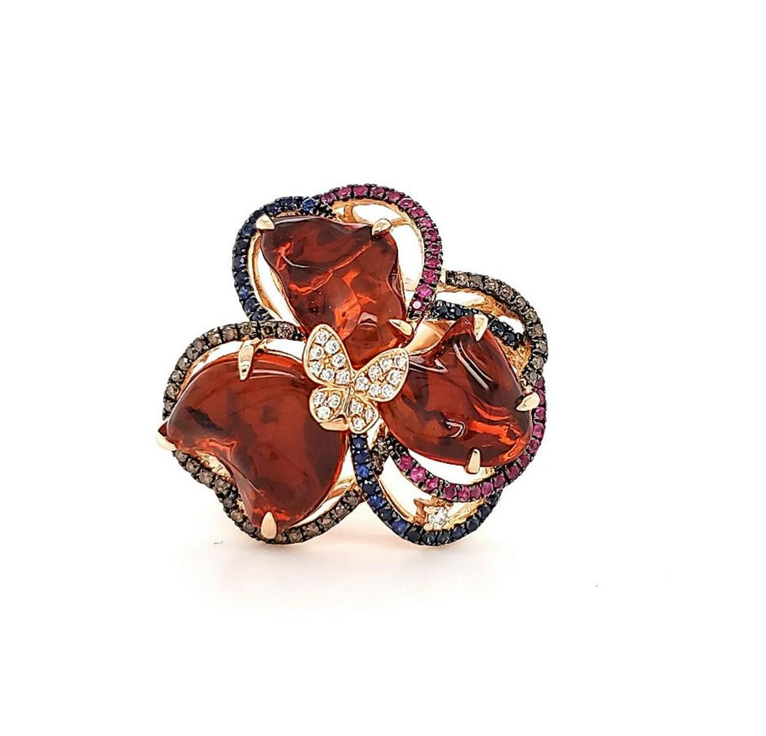 14kt rose gold fire opal and colored stone ring: Ladies 14kt rose gold fire opal and colored stone ring featuring prong set freeform shaped fire opals weighing approx. 5.77ct.. accented with a looping frame of prong set round sapphires weighing 0.23