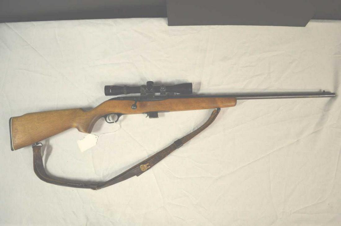 Mossberg 340KC Bolt Action Magazine Fed .22LR: Mossberg 340KC Bolt Action Magazine Fed .22LR Rifle in Blue Metal & Wood. 24" barrel with fixed front sight & rear adjustable sight. 43 7/8" overall with 7 round metal magazine. Serial # none found. S