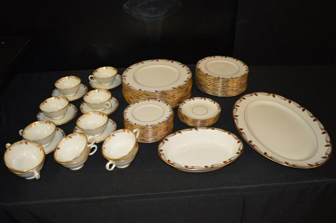 Lenox 62 Piece Set of China in the Essex Pattern: Lenox 62 Piece Set of China in the Essex Pattern, Smooth gold gilt edge with maroon & gold leaf motif on a cream colored base. Gold gilt on verge. Free of chips and crazing & breaks. Made in the U.S.A