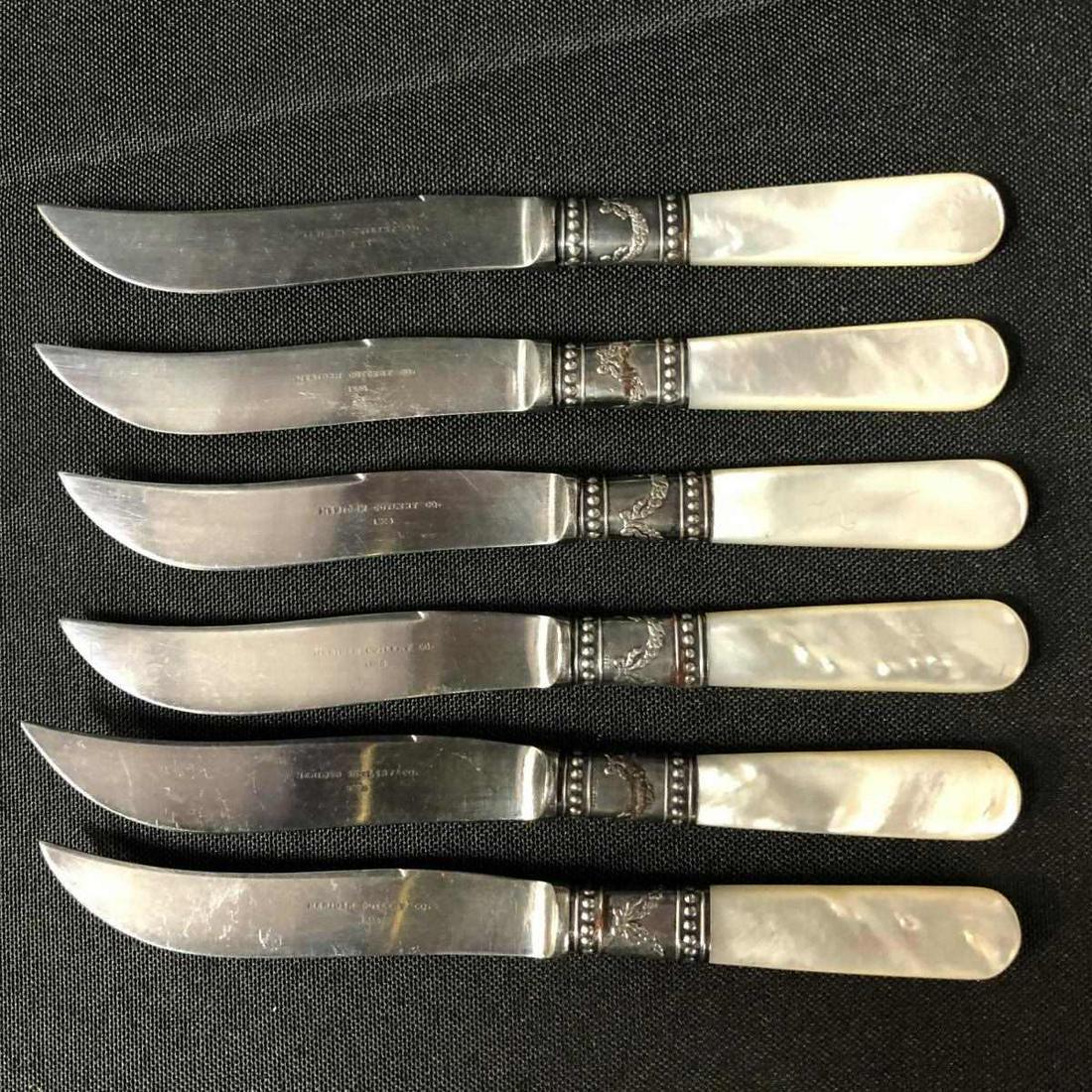 Set 6 Small Knives with Sterling Bands on Handles: Set of 6 Small Meriden Cutlery Co. Knives with Sterling Bands on the Abalone Look Handles. All the blades are marked 1855. Each one is 5 5/8" long. They are embellished with a sterling silver cuff on 