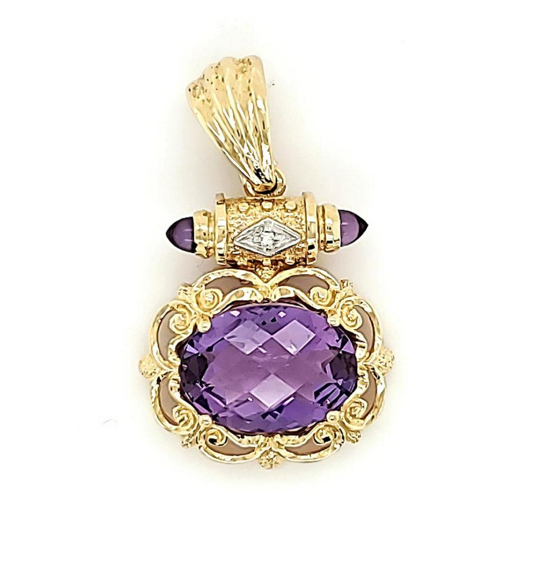 14kt yellow gold amethyst pendant: Ladies 14kt yellow gold amethyst pendant featuring a set oval cut checkerboard cut amethyst measuring 14x10mm. Accented with a scrolling detailed frame and cabochon cut amethyst on the bail. Gross wei