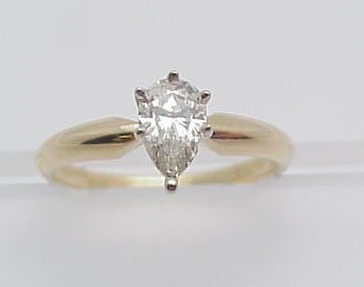 Pear Shape Diamond Engagement Ring: 14K yellow gold lady's pear brilliant diamond solitaire engagement ring, 2.11 grams. There is one prong set, pear shaped diamond, approx. .34 cts, M-N, SI2. Ring size is 5.