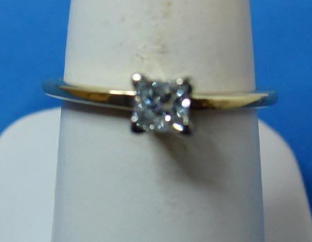 Solitaire Diamond Engagement Ring: 14K yellow gold lady's solitaire diamond engagement ring, 2.00 grams. There is one, 4 prong set, princess cut diamond, approx. .36 cts, G-H, SI2. Ring size is 6 ¾.