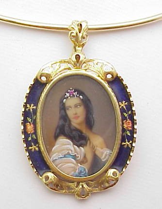 18k enameled photo pin/pendant: Lady's 18k yg filigree pendant weighing 11 grams. Pendant is oval shaped with painted photo of woman with jeweled crown. Frame has flowered antiquing. Can also be used as a pin.