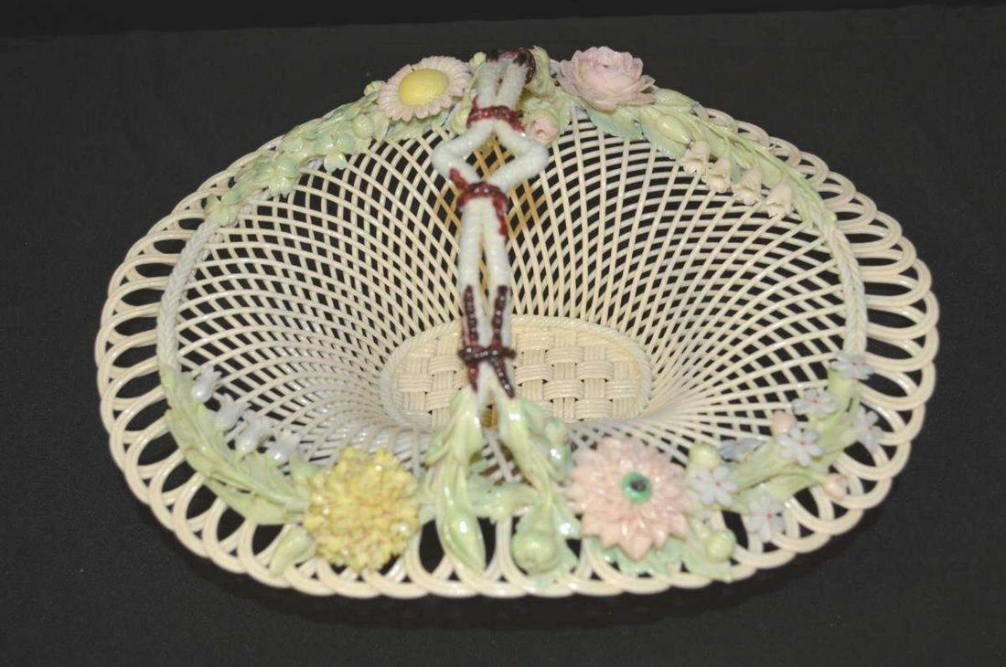 Belleek Porcelain Basket: Belleek Porcelain Basket. Reticulated basket with applied floral and foliate decoration and impressed signature, a beautiful example in excellent condition, 5 1/2"h. 11"w.