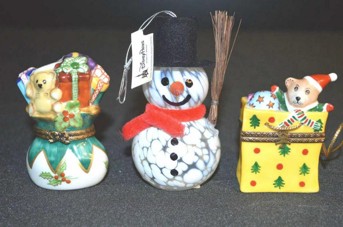 Trio Christmas Porcelain Limoges & Disney Ornament: Trio of Christmas Porcelain Lidded Limoges & a Disney Blown Glass Snowman Christmas Tree Ornament. The Limoges France lidded boxes are hand painted with Makers marks on the bottoms. The yellow Limoges