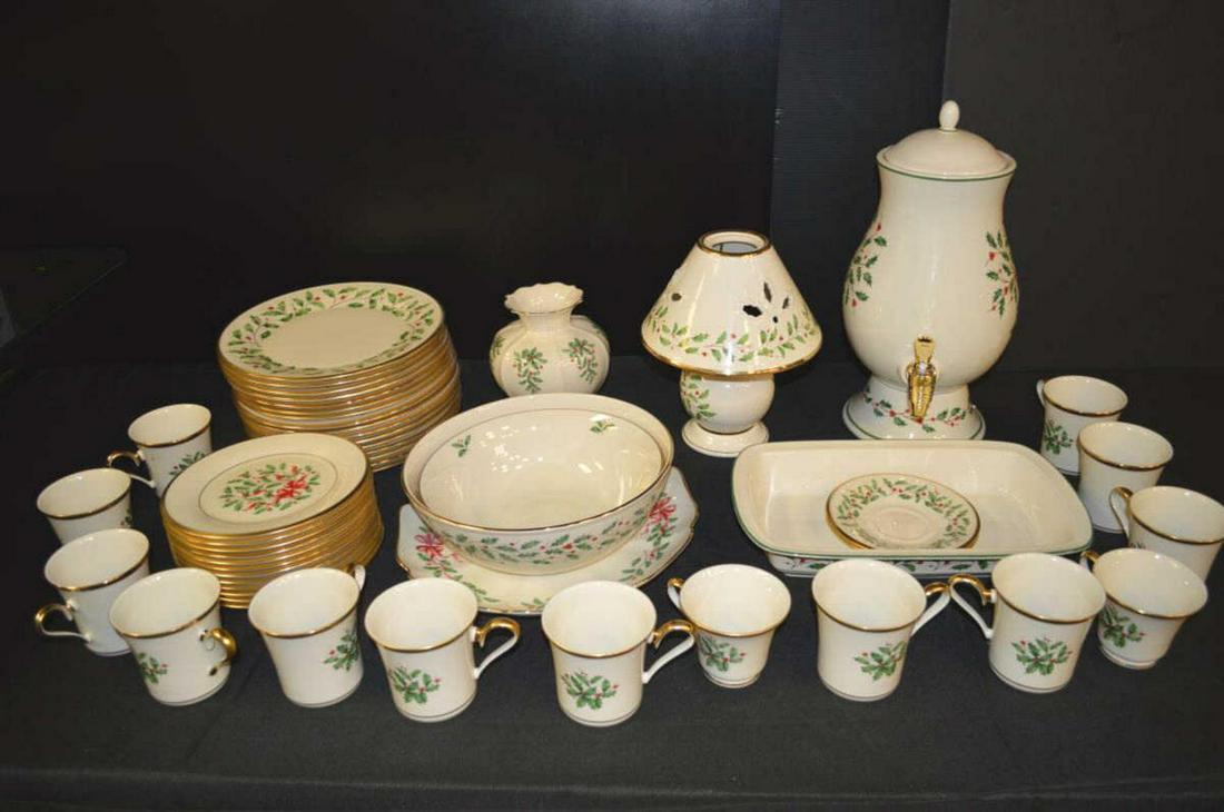 Group of Christmas Theme Lenox China: Group of Christmas Theme Lenox China. Sixteen dinner plates, 10 1/2"dia., twelve salad plates, 8"dia., fourteen coffee cups3 1/2"h., two saucers6"dia., a vase, 7 1/4"h., two bowls, 9 1/2" and 10 1/2"d