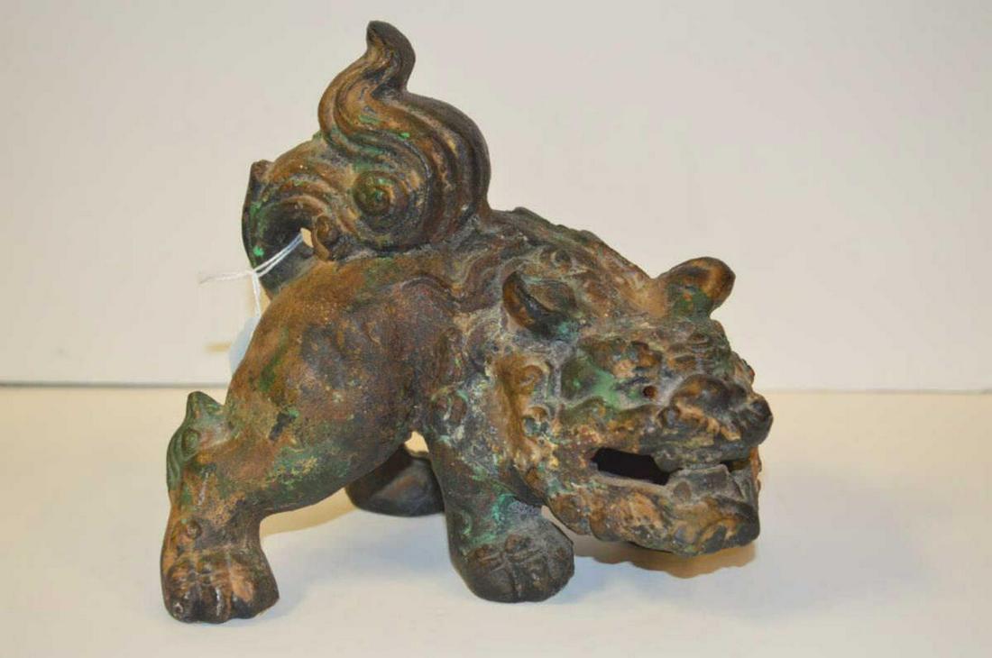 Depiction of a Chinese Ming Dynasty Foo Dog: Depiction of a Chinese Ming or Han Dynasty Standing Foo Dog or Lion Figure. Cast metal with distressed finish. 7" long & 6 1/2" tall. 7.5lbs.