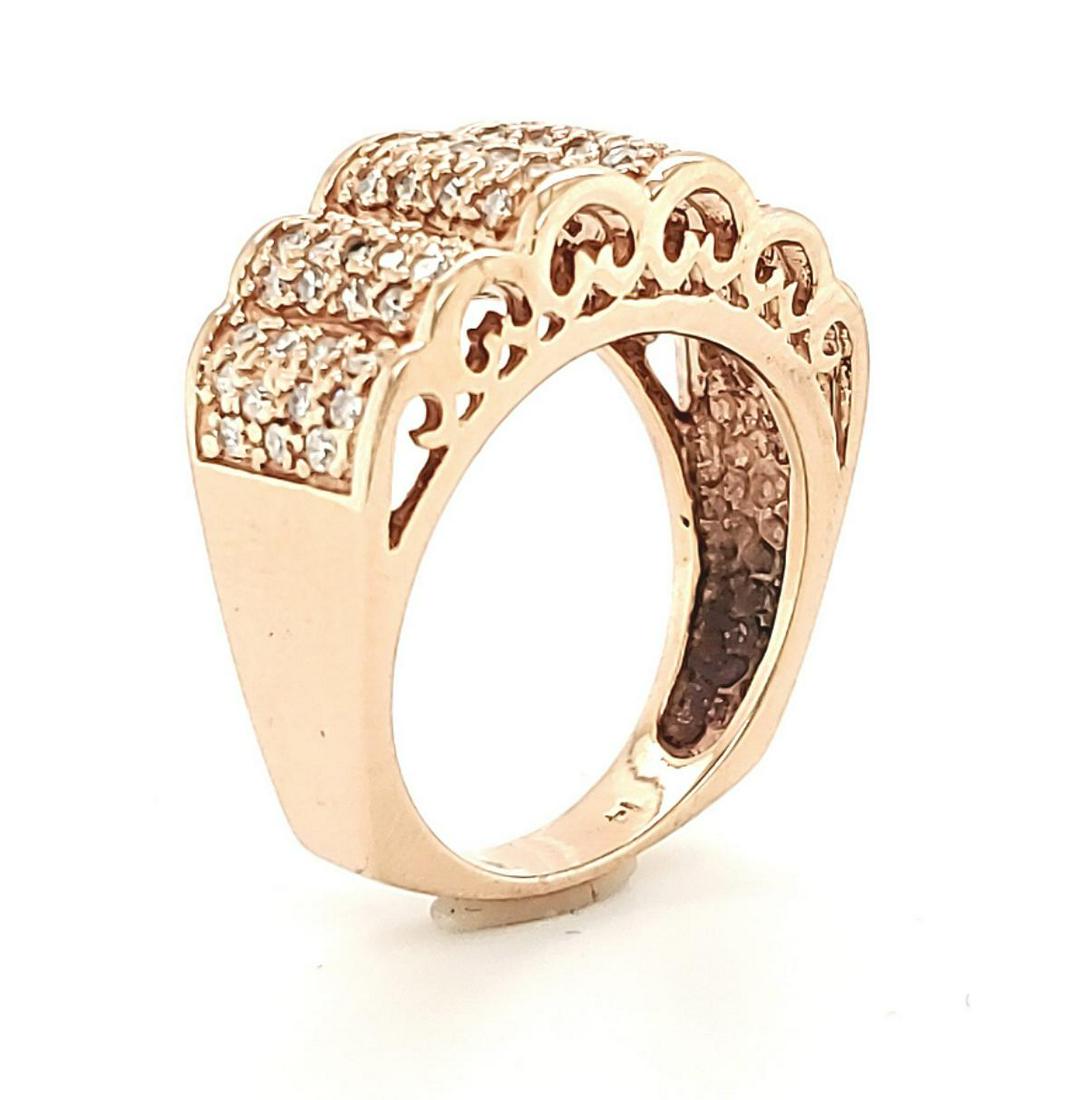 14kt rose gold diamond fashion band: Ladies 14kt rose gold diamond fashion band featuring a scalloped design of prong set singe cut round diamonds weighing approx. 0.50ct.. Top width 10mm. Finger size 7.5. Weight 9.6 grams.