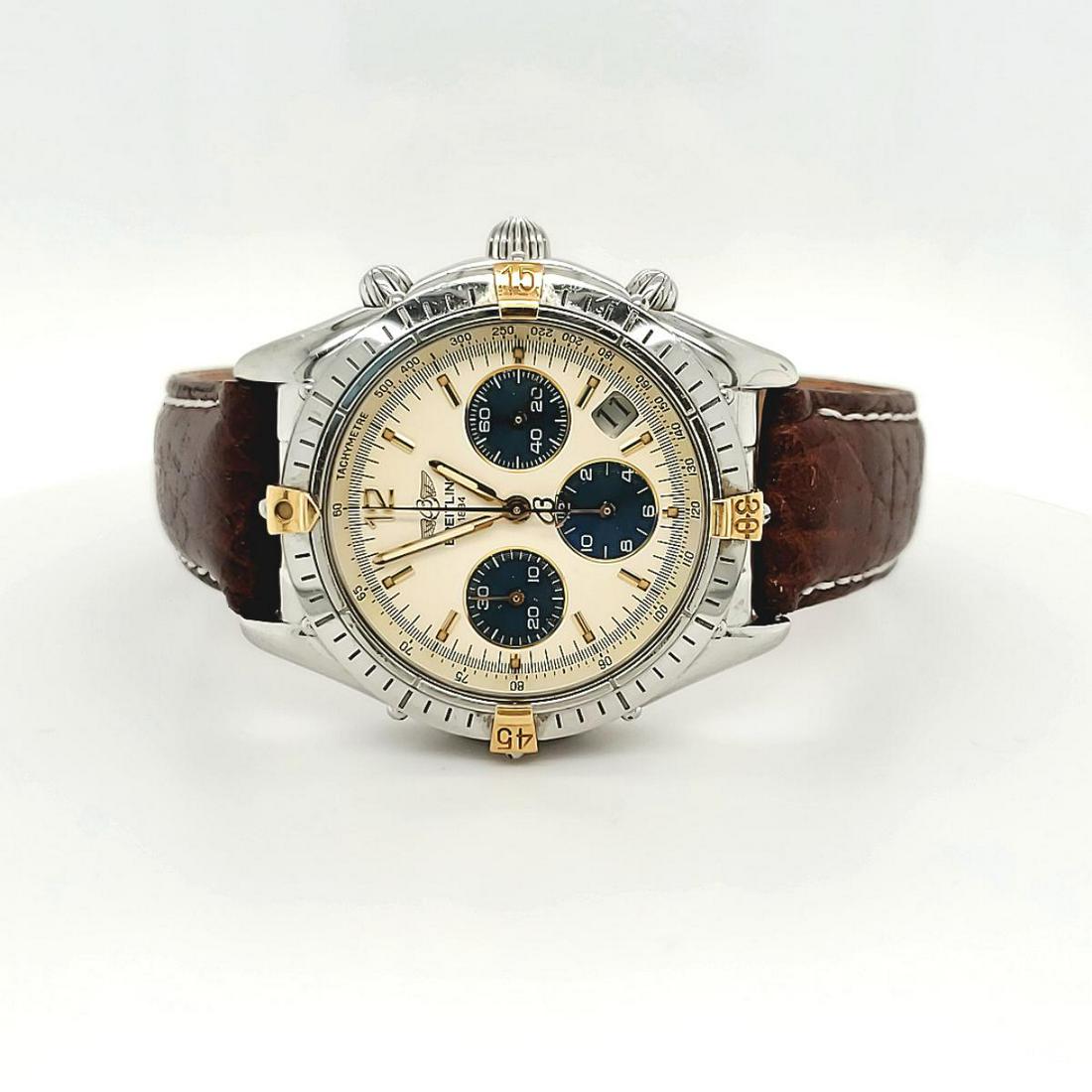 Men's two tone Breitling Chrono Cockpit watch: Men's two tone Breitling Chrono Cockpit watch, model #B3001211G, featuring a stainless steel case with gold accents on the bezel, golden color dial with 3 sub-dials, sapphire crystal, and brown leathe