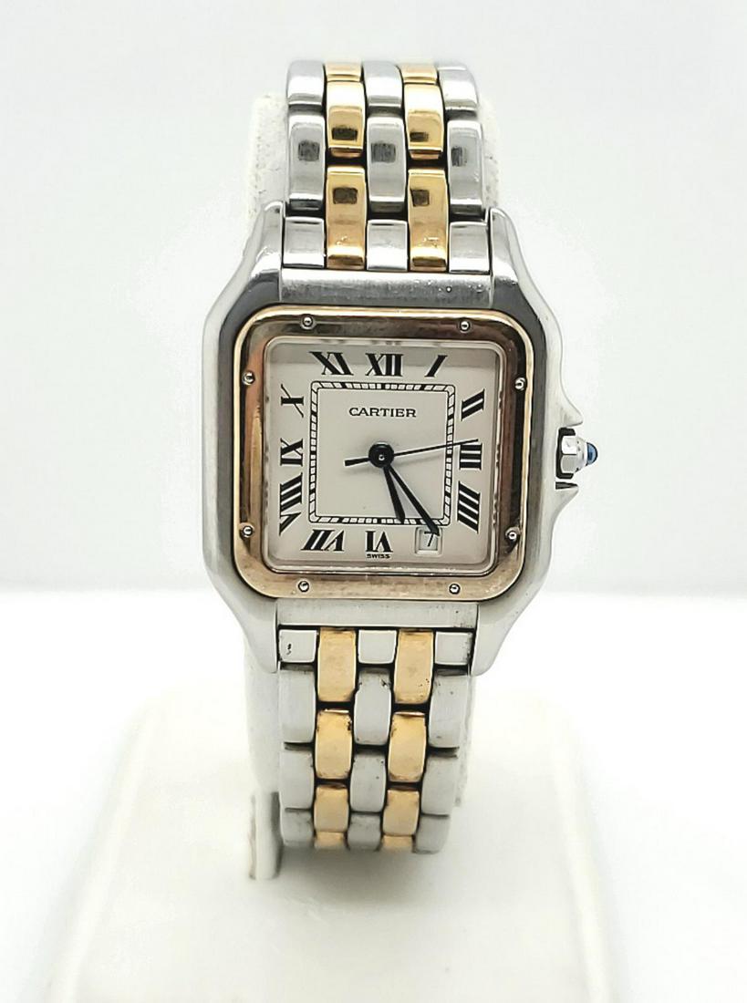 Ladies two tone Panthere quartz watch: Ladies 18k and stainless Cartier Panthere watch with cream colored dial and roman numbers, 18k bezel, Swiss quartz movement, 26.5mm case, and hidden deployment clasp.