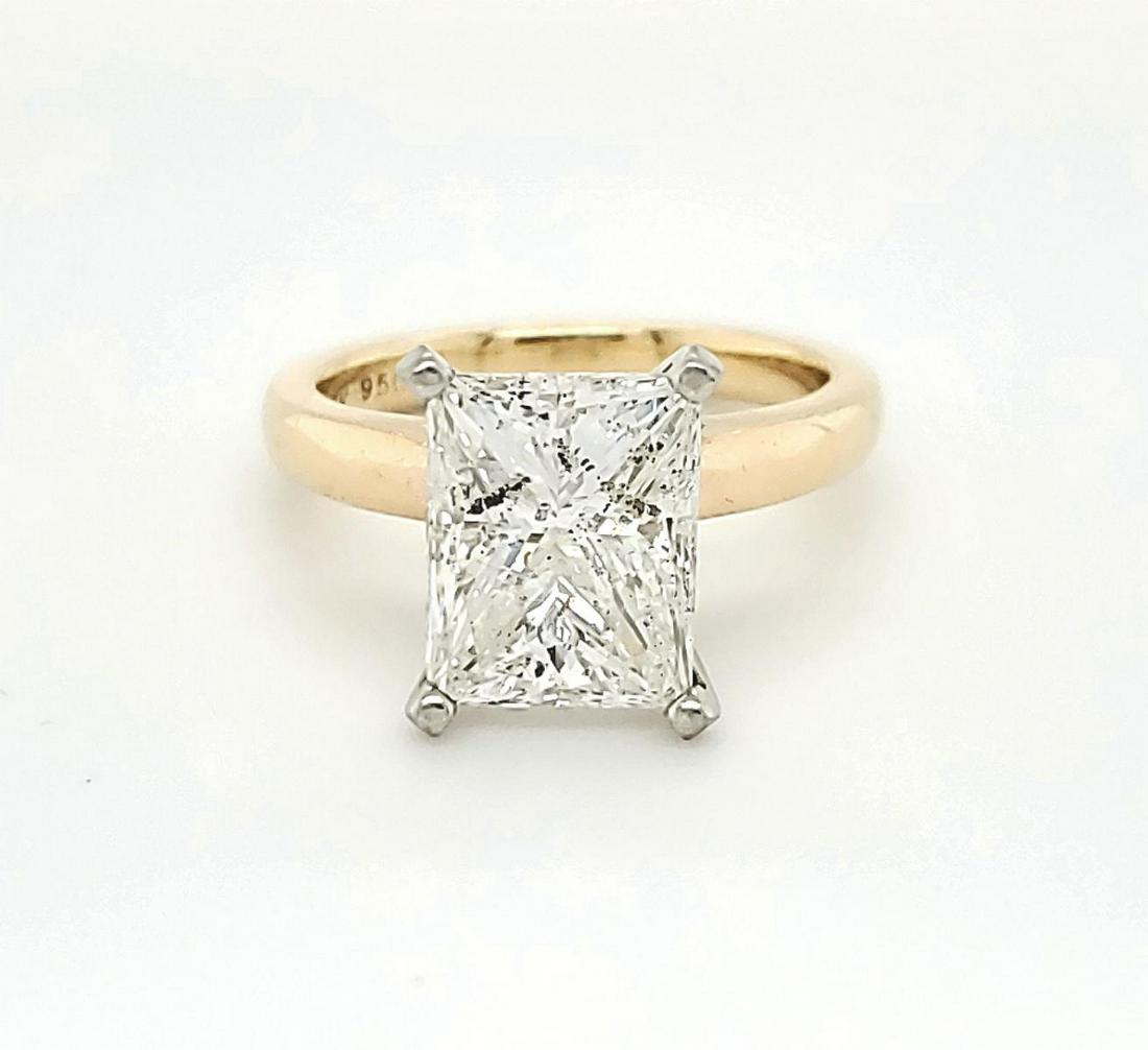 14kt yellow gold diamond solitaire ring, 3.87ct: Ladies 14kt yellow gold diamond solitaire ring featuring a prong set rectangular princess cut diamond weighing approx. 3.87ct., Clarity I2, Color H, Clarity enhanced. Mounted in a 2.5mm setting. Finge