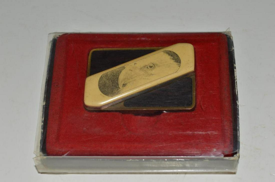 Gerber Touche' Scrimshaw Belt Buckle Knife: Gerber Touche' scrimshaw belt buckle knife from the 1960's. The buckle features a unique buckle and knife design with a bald eagle scrimshaw on the handle of the knife. The construction of the buckle 