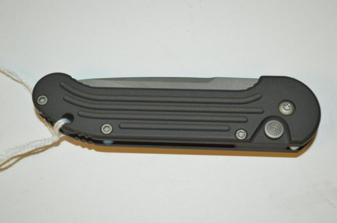 Microtech Automatic Folding Flick Knife New Sheath: Microtech U.D.T. Automatic Folding Flick Knife New in Sheath. This great knife has a combo, smooth/serrated edge blade. It has a 2 3/4" blade, 6 1/2" overall open, 3 5/8" folded. Nylon Microtech black