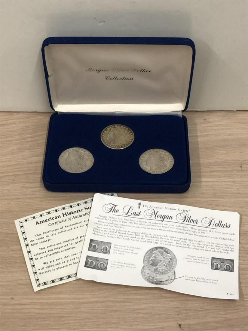 1921 P-D-S Morgan Silver Dollar "Last Year" Set: 1921 P-D-S Morgan Silver Dollar "Last Year" Set. One Morgan dollar from each of the three mints, Philadelphia, Denver, and San Francisco, housed in a felt lined presentation case. Comes with info shee