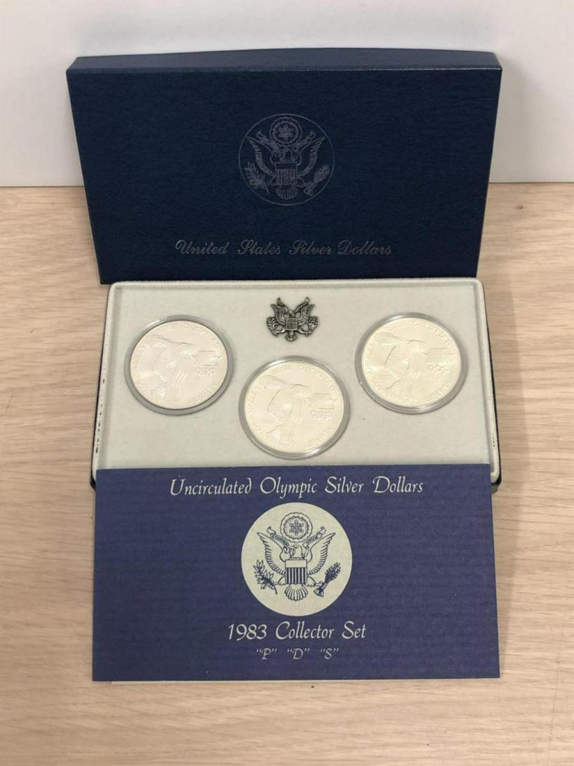 1983 P-D-S Olympic Silver Uncirculated $1 Set: 1983 P-D-S Olympic Silver Uncirculated $1 Collectors Set consists of the Discus Thrower design, from the Philadelphia, Denver, and San Francisco Mint. All 3 coins are in BU condition, in their origina